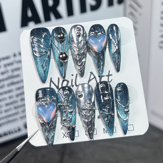 Handmade nail art stickers featuring a space galaxy design with hand-painted butterflies. These are long pointed European-style finished nail tips for wearing.